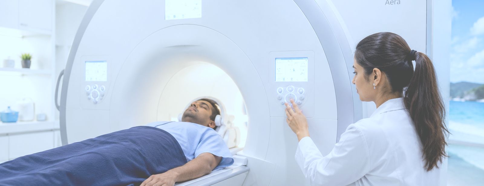 Wide view of the MRI suite, with the scanner gantry, patient table and control console.